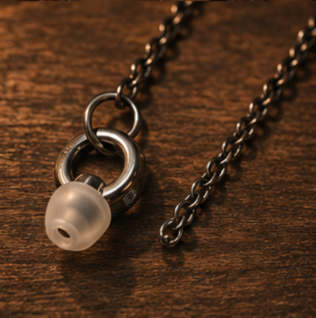 ARKS black chain and earplug hardware close-up
